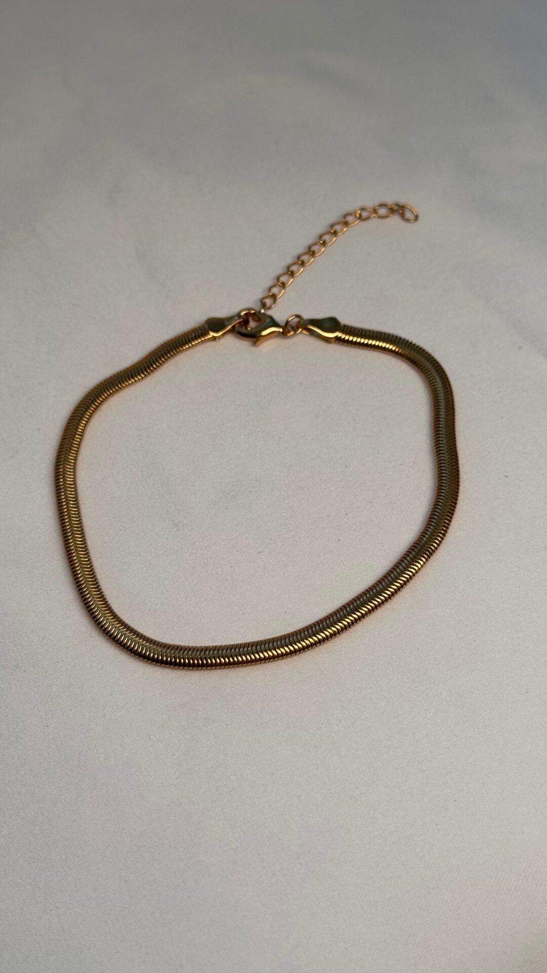 TORNOZELEIRA MALEAVEL BANHO OURO 18K