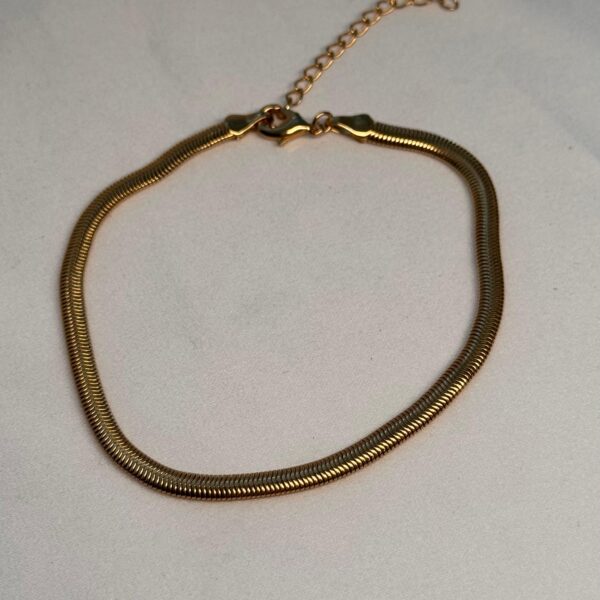 TORNOZELEIRA MALEAVEL BANHO OURO 18K